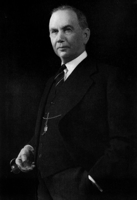 A high-quality, black-and-white, image of Daniel C. Roper as Secretary of Commerce standing for a portrait.