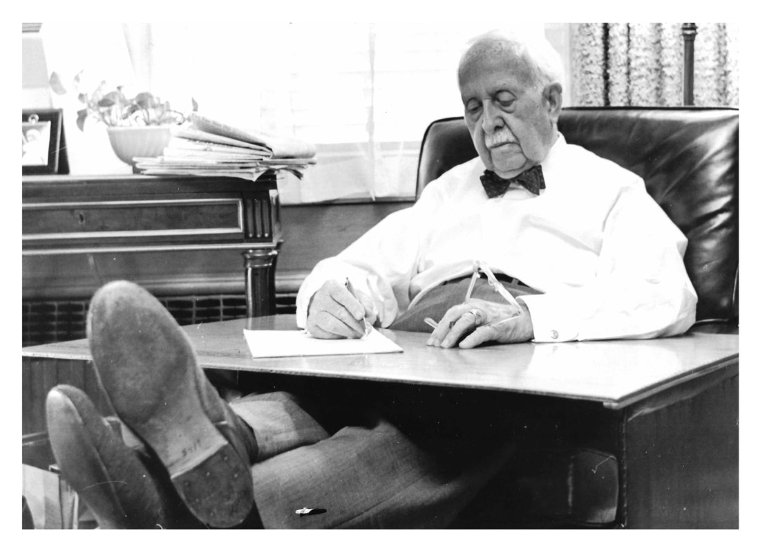 Picture of J. C. Penney at his desk.