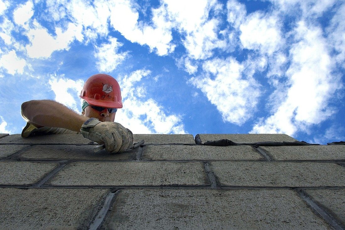 Image of a bricklayer building a cathedral.