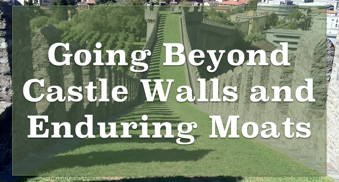 A picture of a castle's battlements overlooking a castle wall and moats with the tagline: 