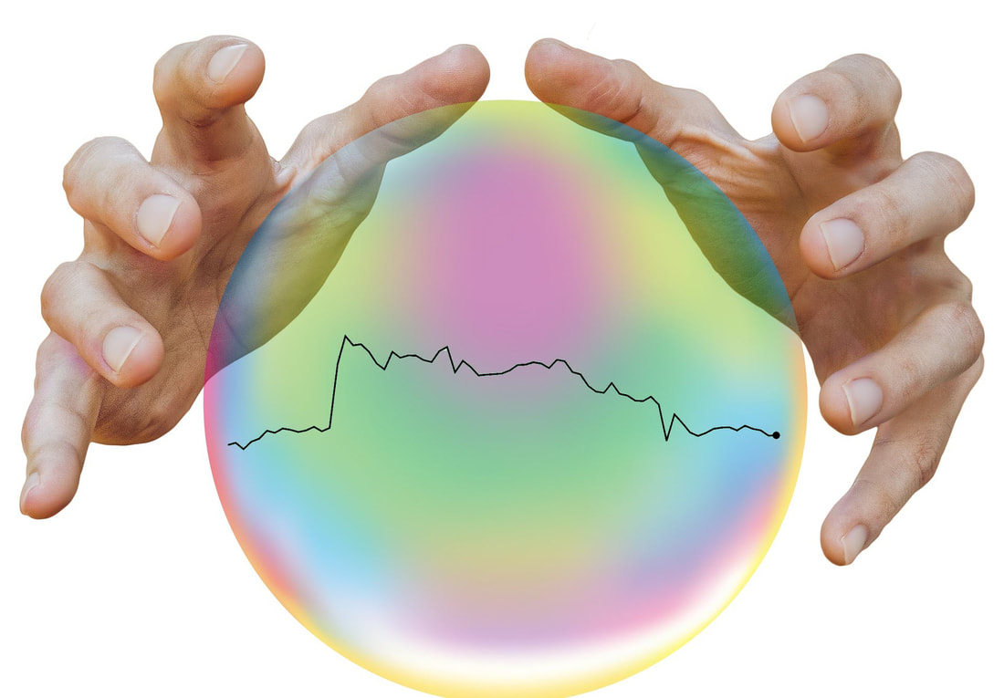 Picture of crystal ball with two hands and an IBM stock price chart.