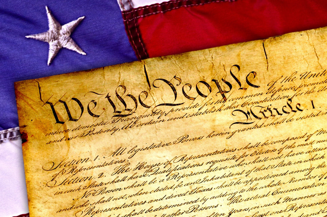Image of the preface to the United States Constitution: We the People.