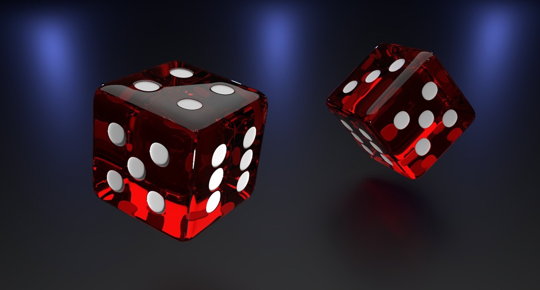 Picture of dice falling through the air.