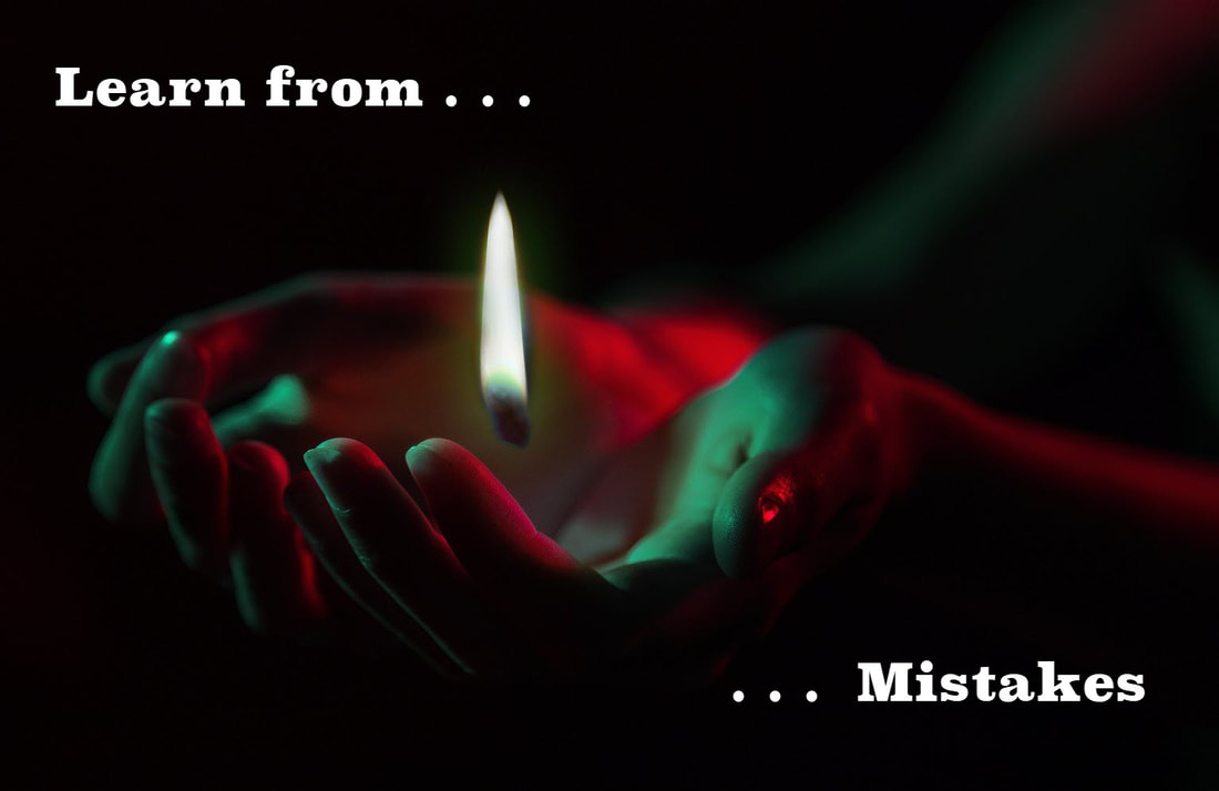 Picture of hands producing fire as a symbol of being burned by a mistake with the tagline: 