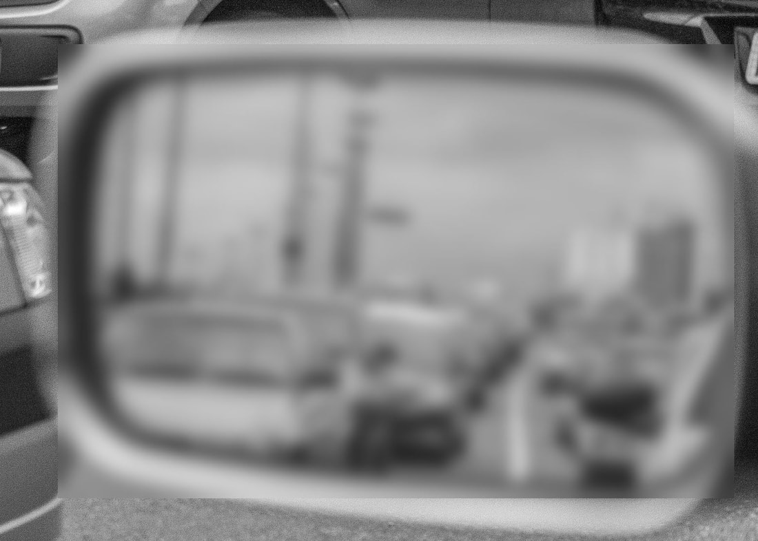 Blurred rear-view mirror
